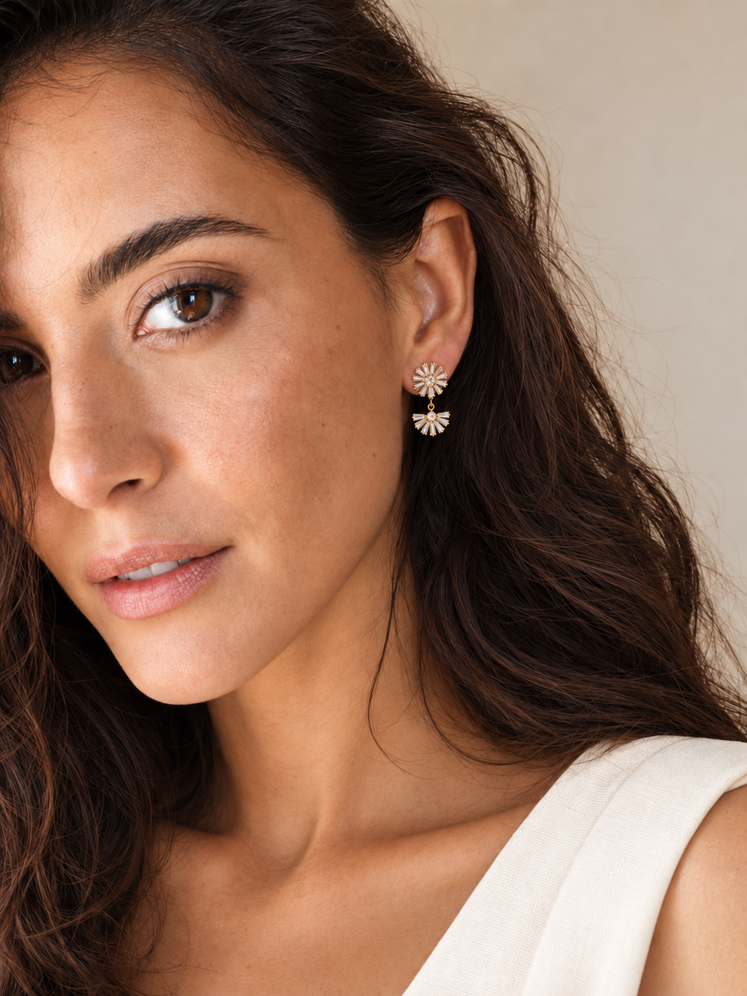 Pareja de Pendientes Copo Gold con cristales baguette y baño de oro de 18 quilates